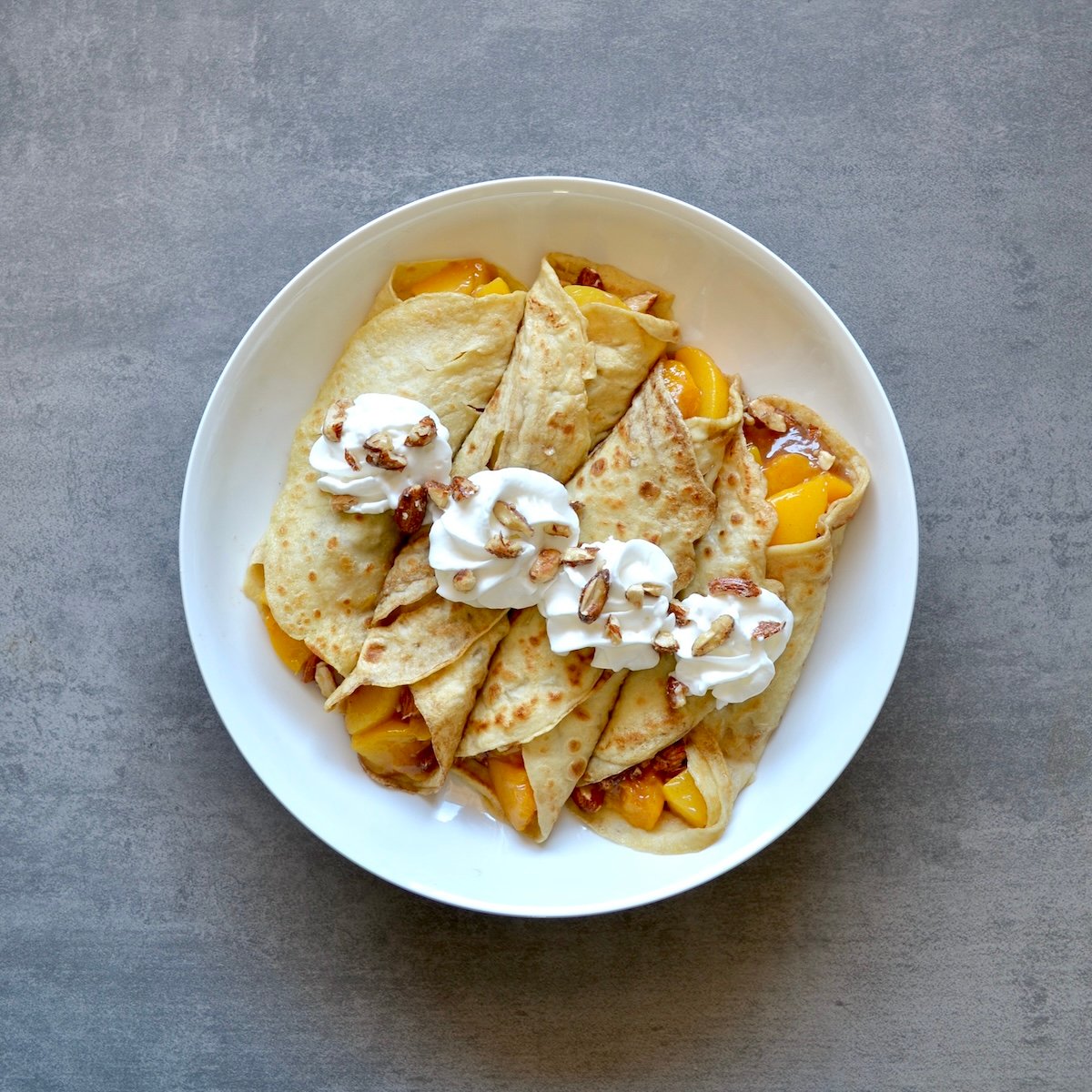 Peach Crepes with Candied Almonds